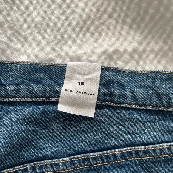 Good American 90’s High Waisted Denim Split Level Hem Shorts