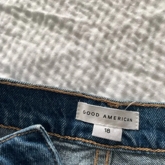 Good American 90’s High Waisted Denim Split Level Hem Shorts