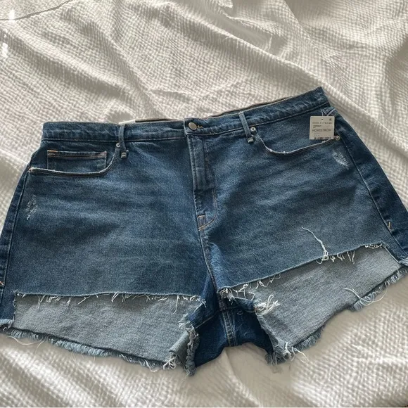 Good American 90’s High Waisted Denim Split Level Hem Shorts