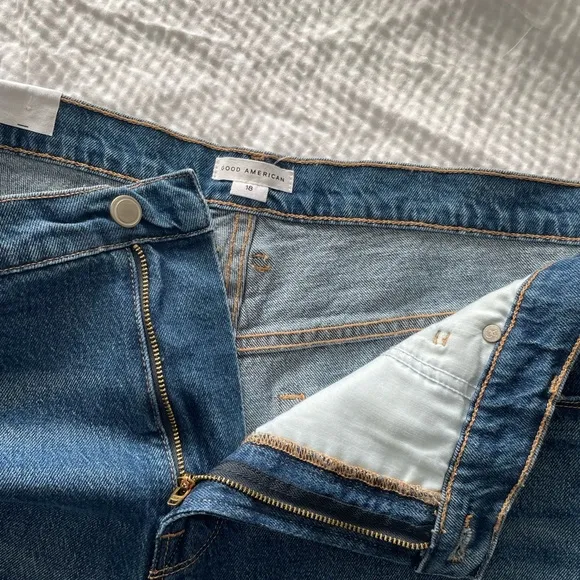 Good American 90’s High Waisted Denim Split Level Hem Shorts
